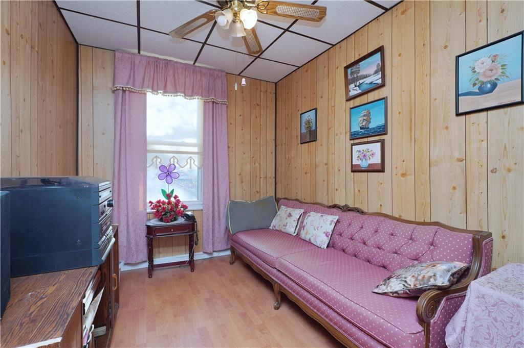 649 Bay Ridge Parkway Brooklyn, NY 11209 - Photo 21 of 29 a living room with furniture and a window