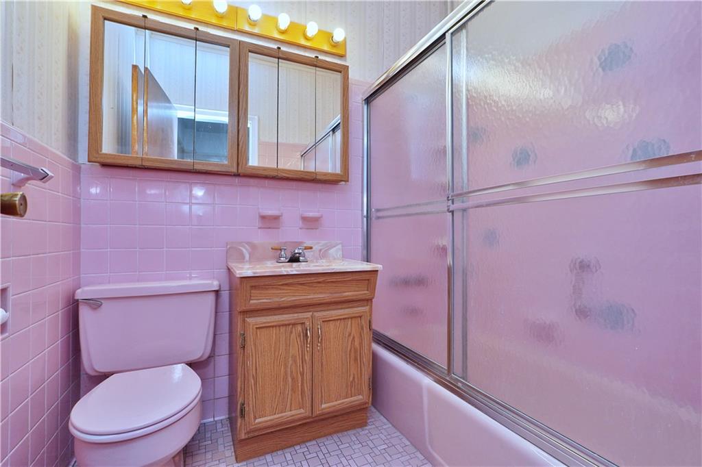 649 Bay Ridge Parkway Brooklyn, NY 11209 - Photo 24 of 29 a bathroom with a toilet sink and mirror