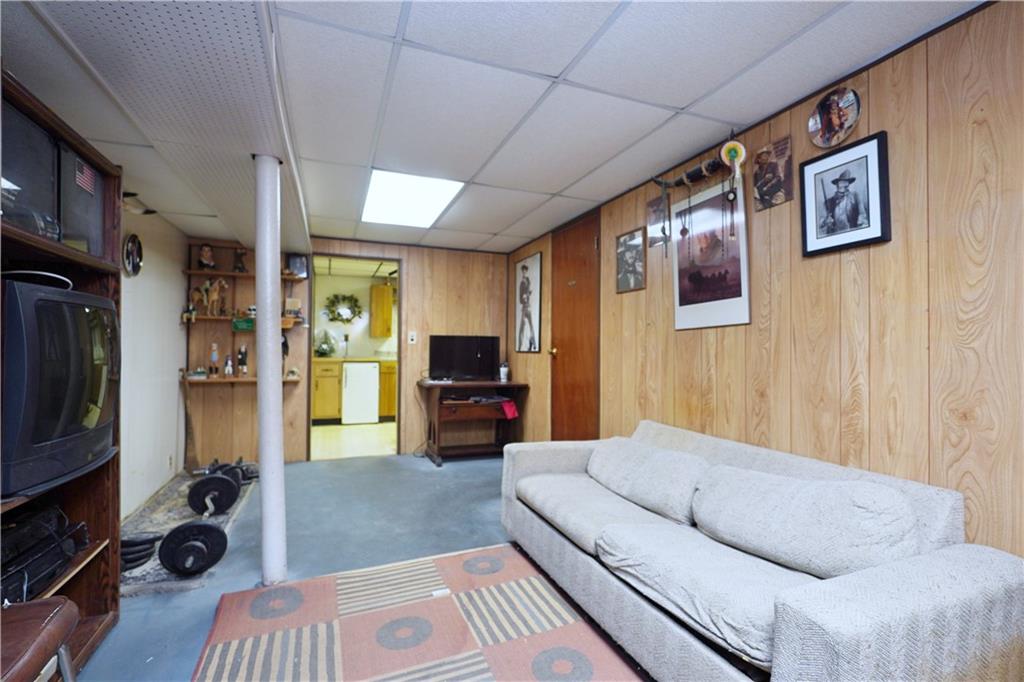 649 Bay Ridge Parkway Brooklyn, NY 11209 - Photo 25 of 29 a living room with furniture and a flat screen tv
