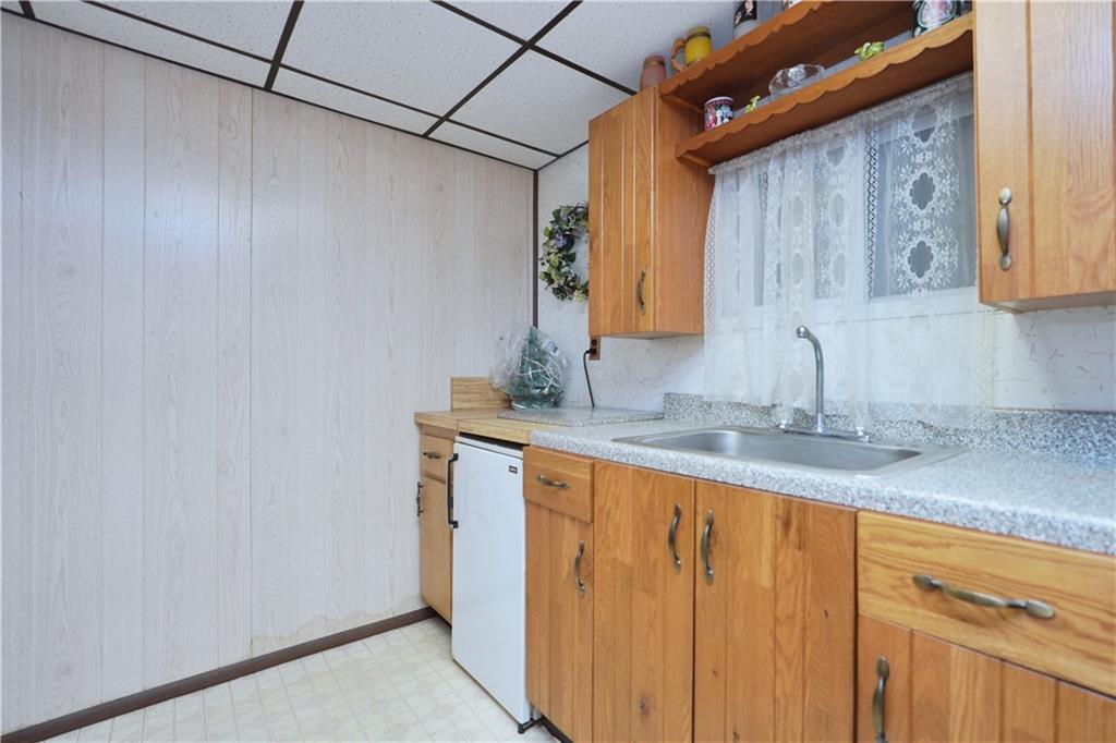 649 Bay Ridge Parkway Brooklyn, NY 11209 - Photo 28 of 29 a bathroom with a granite countertop sink and a mirror