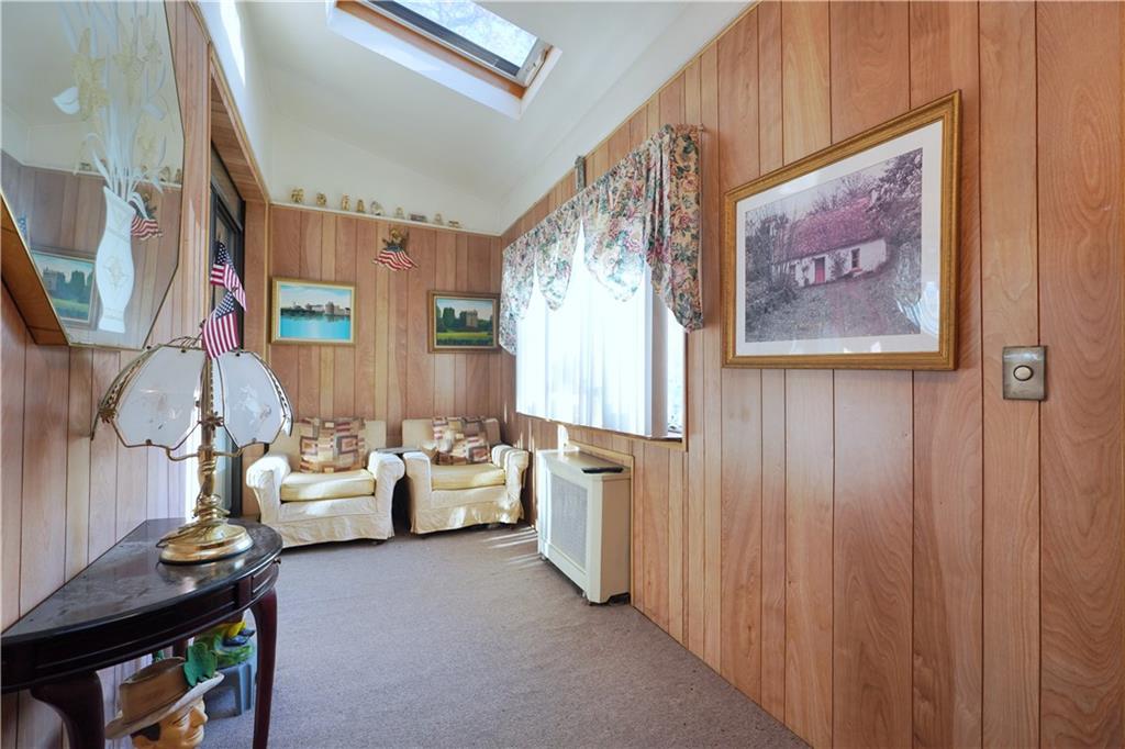 649 Bay Ridge Parkway Brooklyn, NY 11209 - Photo 3 of 29 a living room with furniture and a flat screen tv