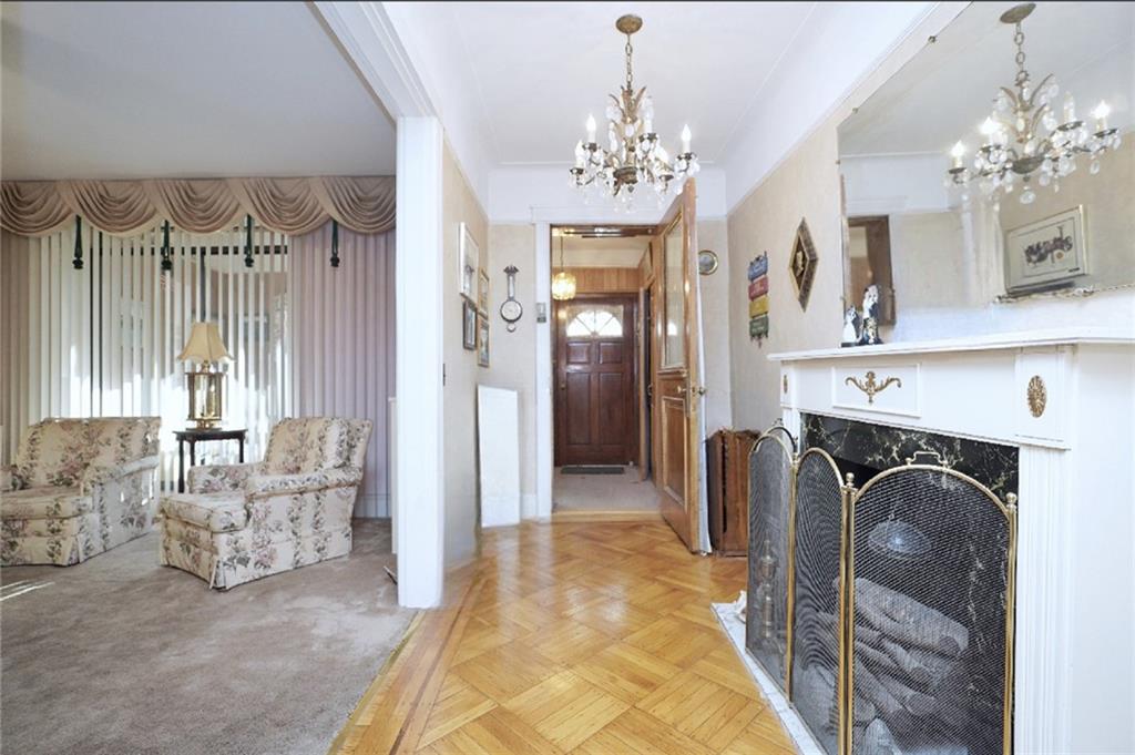 649 Bay Ridge Parkway Brooklyn, NY 11209 - Photo 6 of 29 a view of a bedroom with furniture and chandelier