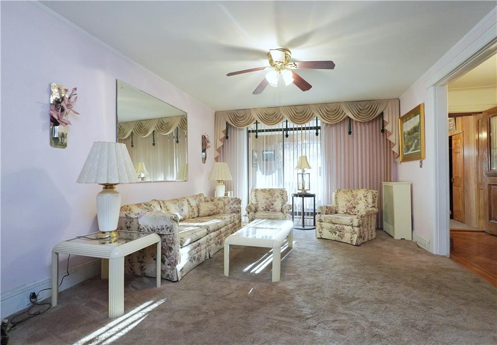 649 Bay Ridge Parkway Brooklyn, NY 11209 - Photo 7 of 29 a living room with furniture and a chandelier