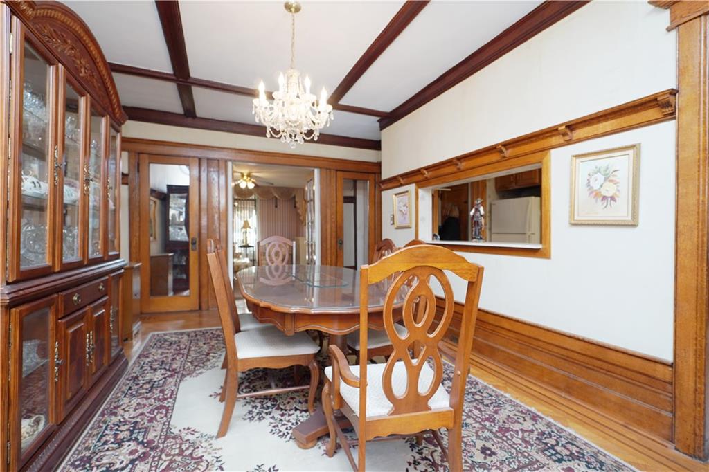 649 Bay Ridge Parkway Brooklyn, NY 11209 - Photo 8 of 29 a dining room with furniture chandelier and wooden floor