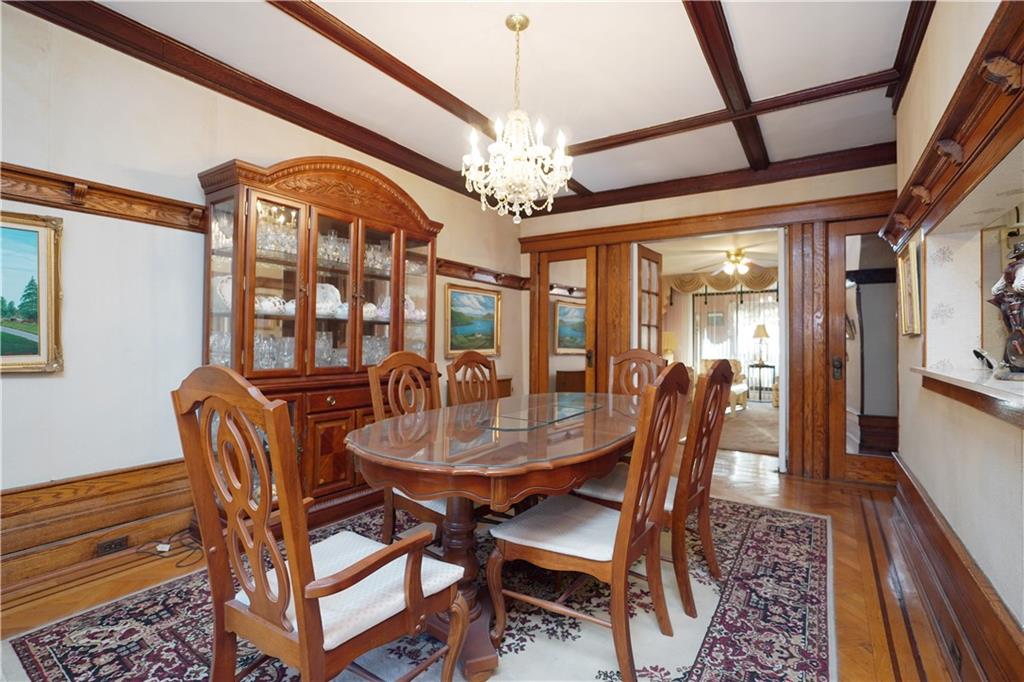 649 Bay Ridge Parkway Brooklyn, NY 11209 - Photo 10 of 29 a dining room with furniture a chandelier and wooden floor