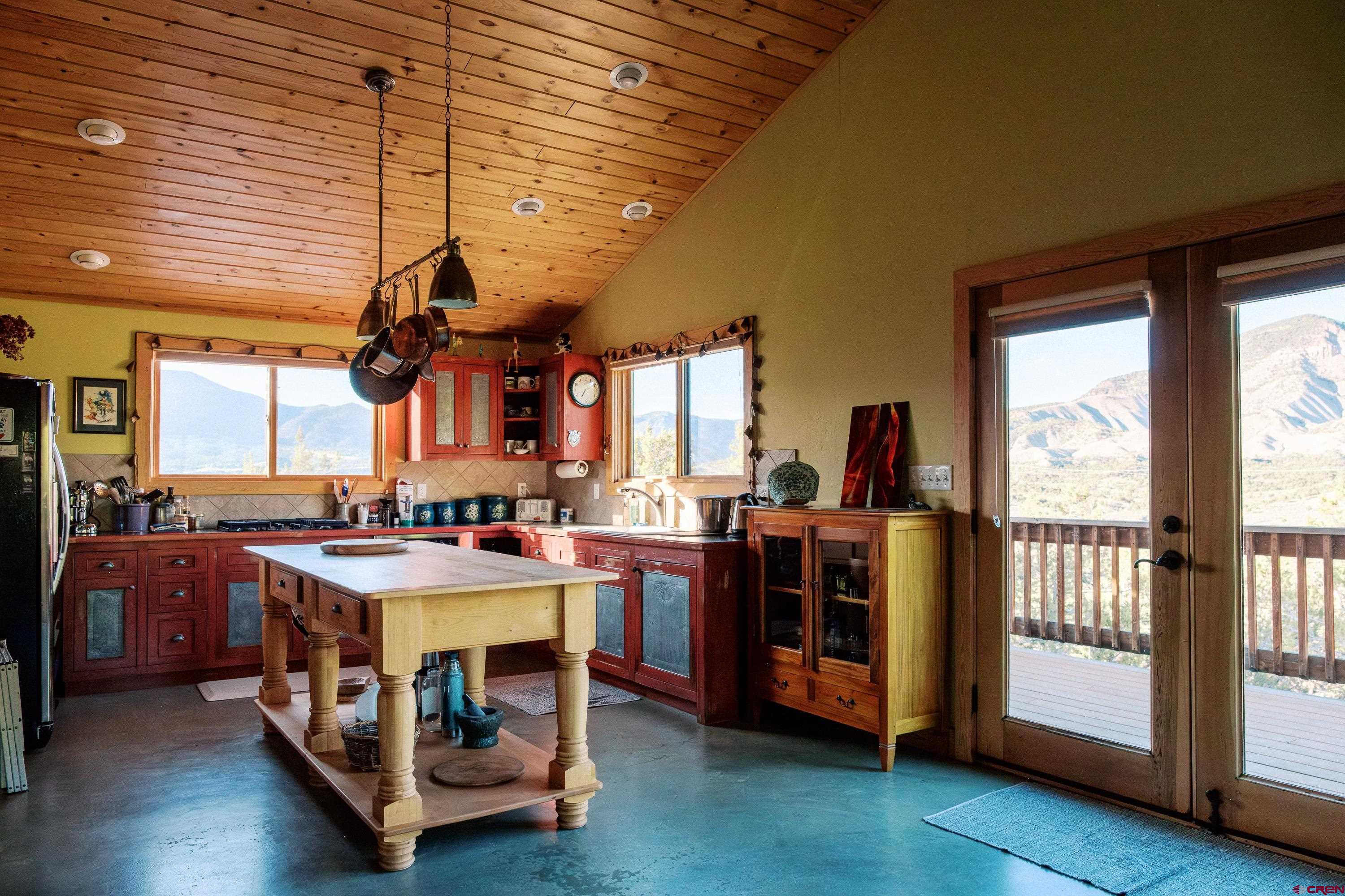 41723 O Road Paonia, CO 81428 - Photo 33 of 44 a kitchen with stainless steel appliances granite countertop a stove and a refrigerator