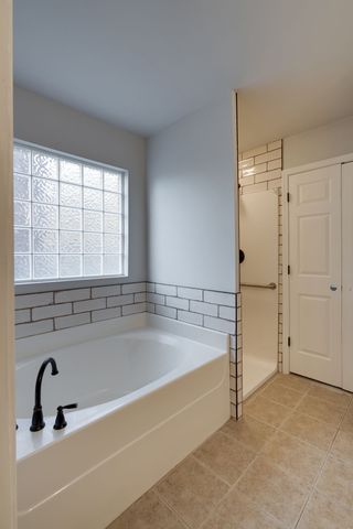 a bathroom with a bathtub and a sink