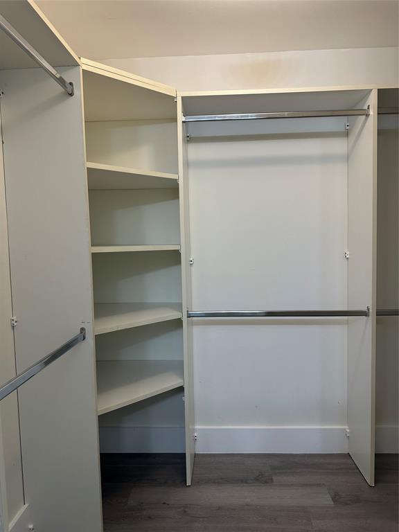 159 Northwest 70th Street, Unit 517 Boca Raton, FL 33487 - Photo 20 of 30 a view of walk in closet with empty racks