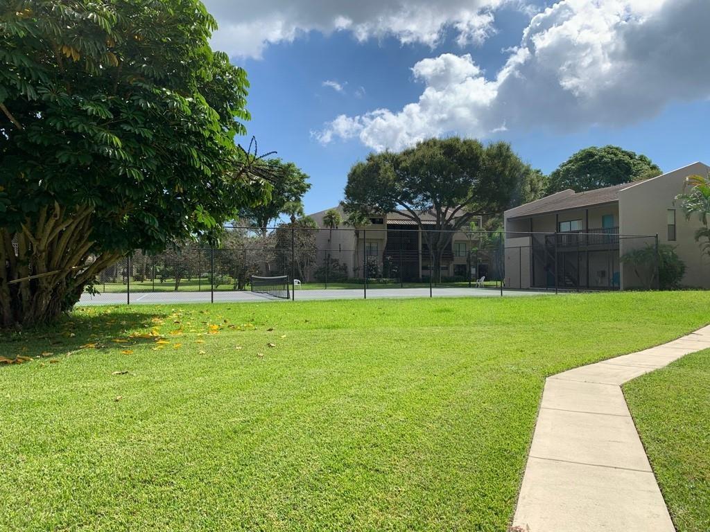159 Northwest 70th Street, Unit 517 Boca Raton, FL 33487 - Photo 2 of 30 a view of a backyard with a garden