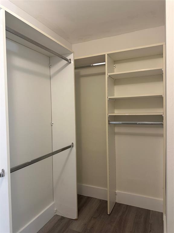 159 Northwest 70th Street, Unit 517 Boca Raton, FL 33487 - Photo 22 of 30 a view of walk in closet with empty racks