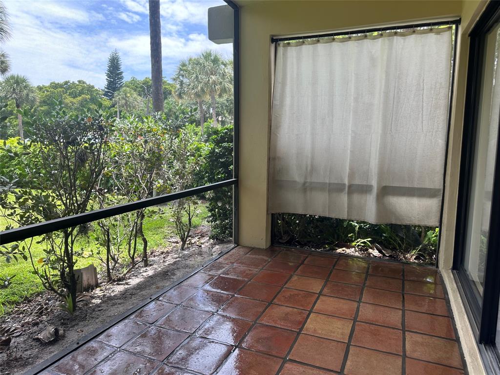 159 Northwest 70th Street, Unit 517 Boca Raton, FL 33487 - Photo 28 of 30 a view of a balcony with wooden floor