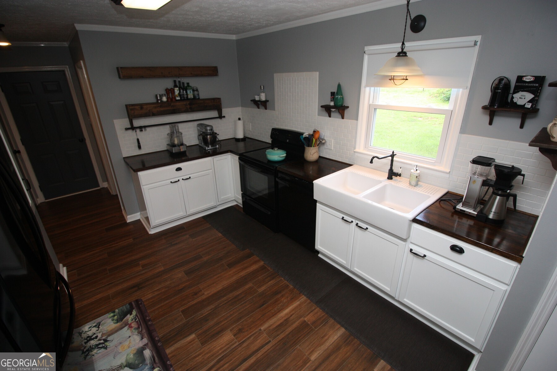 231 Murphy Road LaGrange, GA 30240 - Photo 9 of 24 a utility room with cabinets washer and dryer
