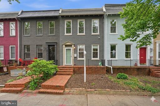 215 15th Street Northeast Washington, DC 20002 - Photo 1 of 43 a front view of a house with garden