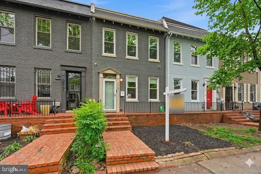 215 15th Street Northeast Washington, DC 20002 - Photo 2 of 43 a front view of a house with garden