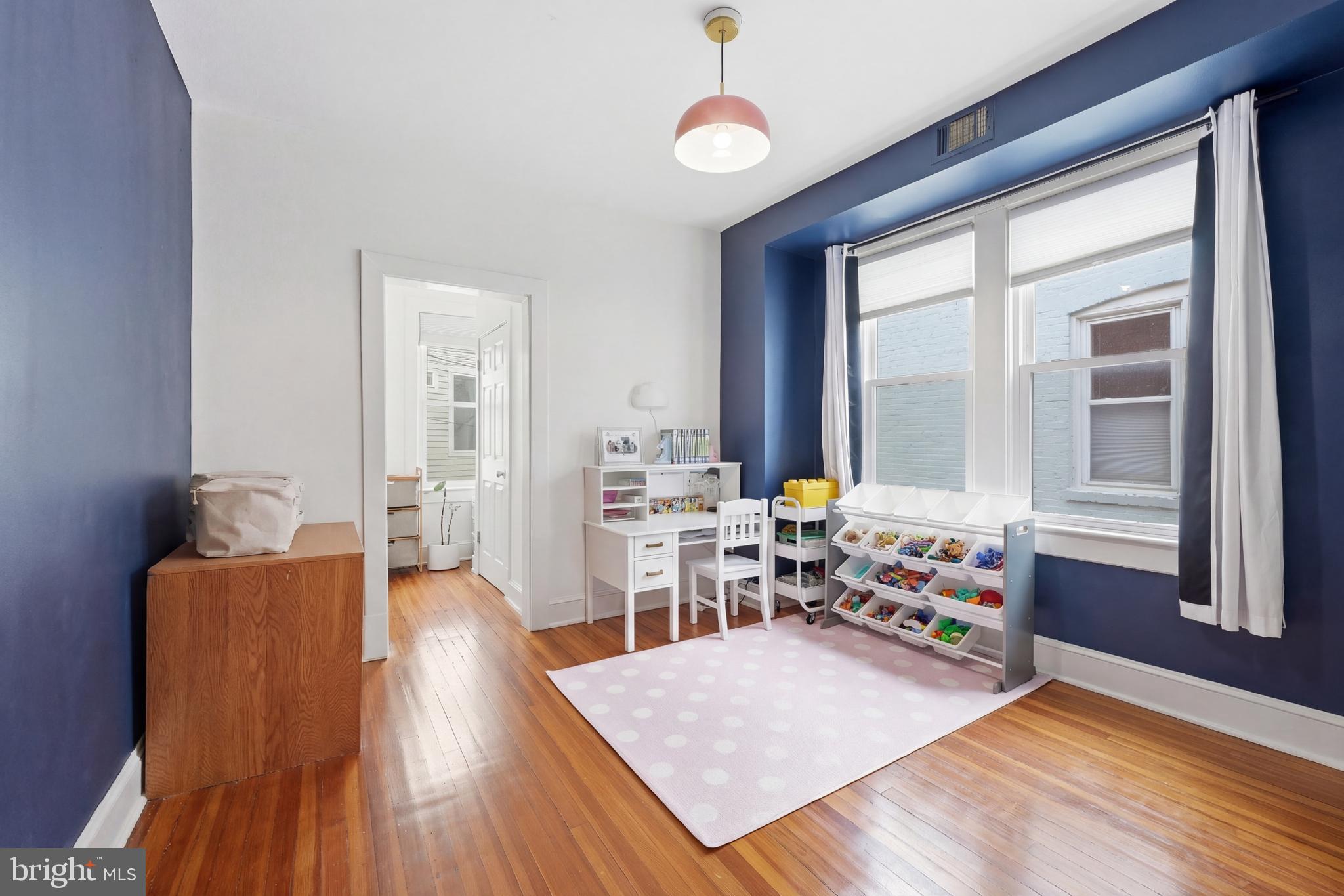 215 15th Street Northeast Washington, DC 20002 - Photo 25 of 43 a living room with furniture and a window