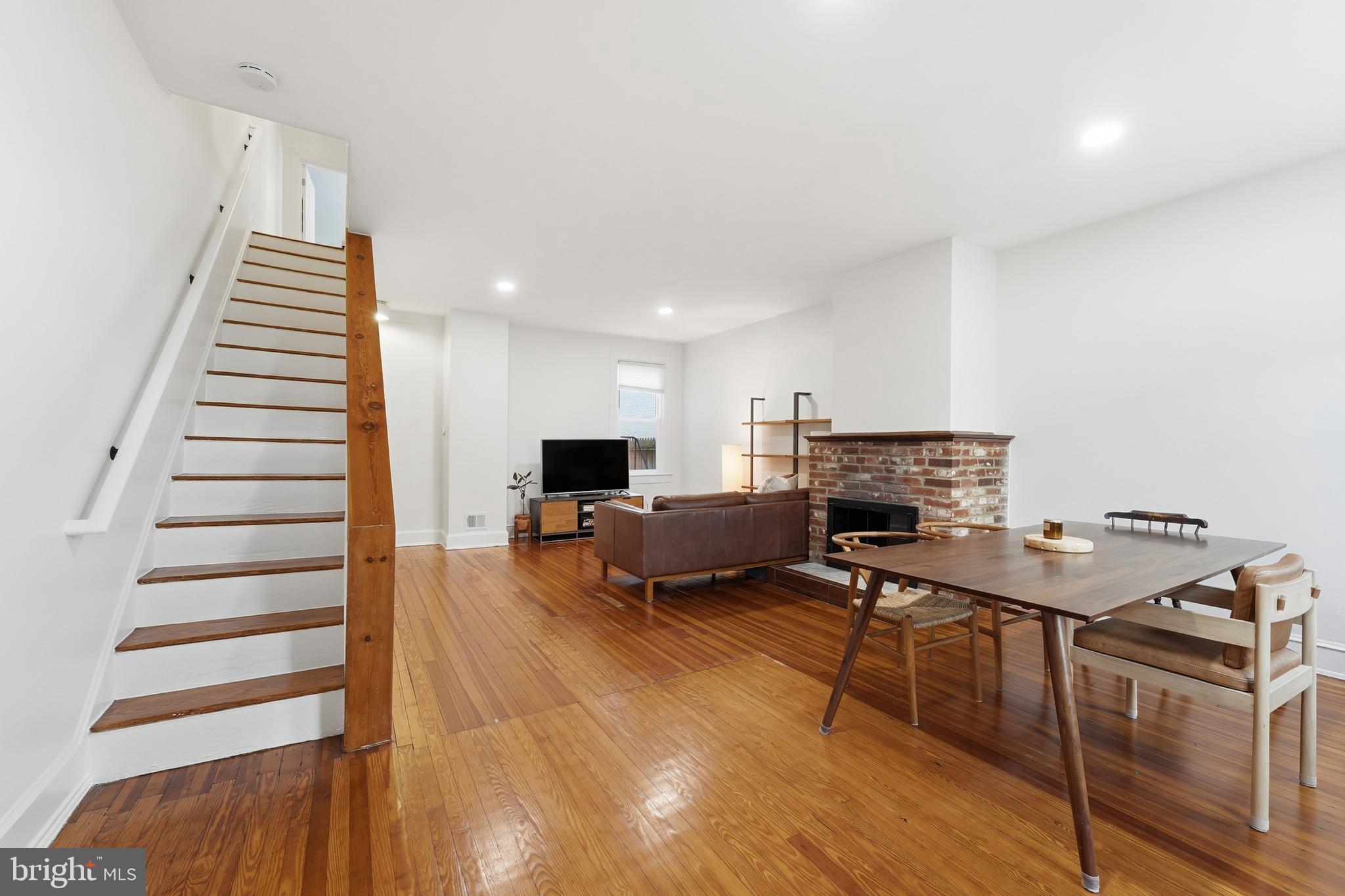 215 15th Street Northeast Washington, DC 20002 - Photo 4 of 43 a living room with furniture and a wooden floor