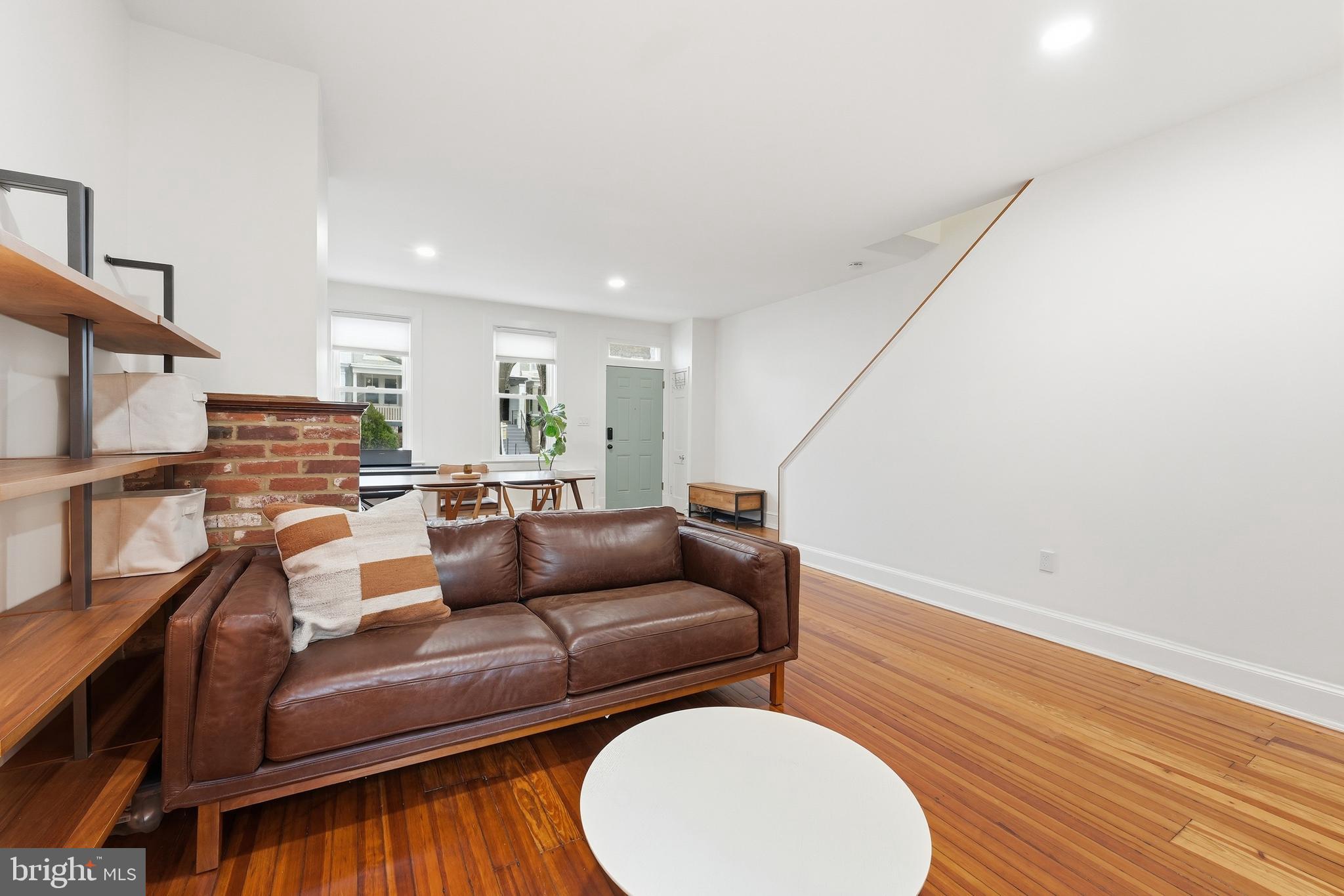 215 15th Street Northeast Washington, DC 20002 - Photo 6 of 43 a living room with furniture and a wooden floor
