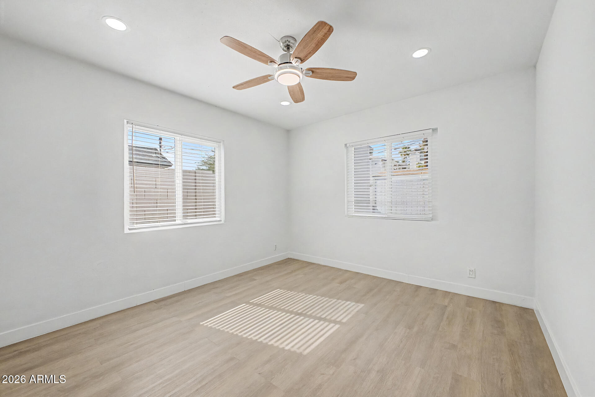 532 East Cheery Lynn Road Phoenix, AZ 85014 - Photo 15 of 37 wooden floor in an empty room with a window