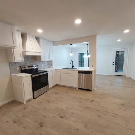 an empty room with a empty space and a ceiling fan