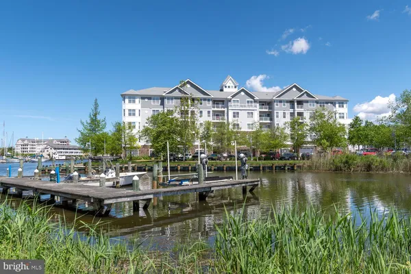 a view of a lake with a house in the background