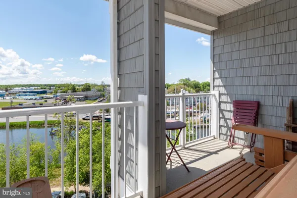 a view of a balcony with chairs