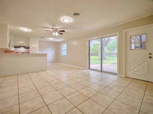 a view of a kitchen with marble kitchen appliances and cabinets