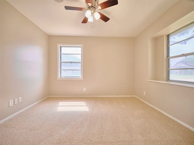 a view of empty room with windows