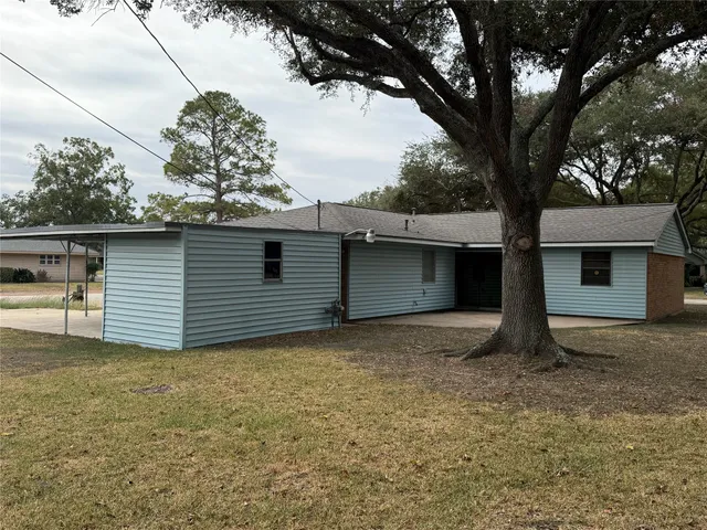 a house with trees in front of it