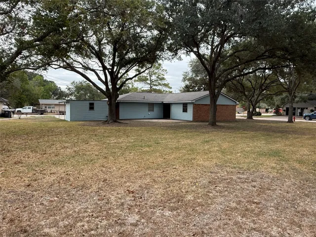 a house with trees in front of it
