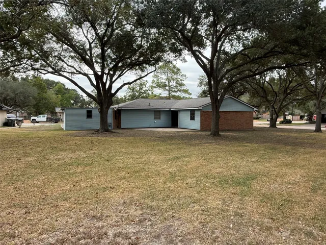 a house with trees in front of it