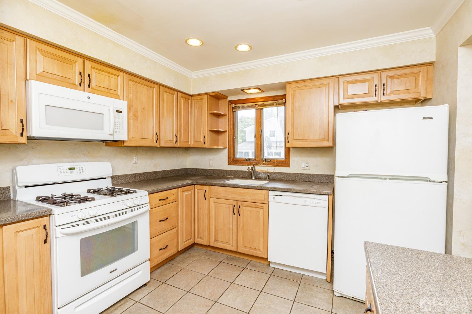 38 Marlin Avenue East Edison, NJ 08820 - Photo 11 of 36 a kitchen with a white cabinets and white appliances