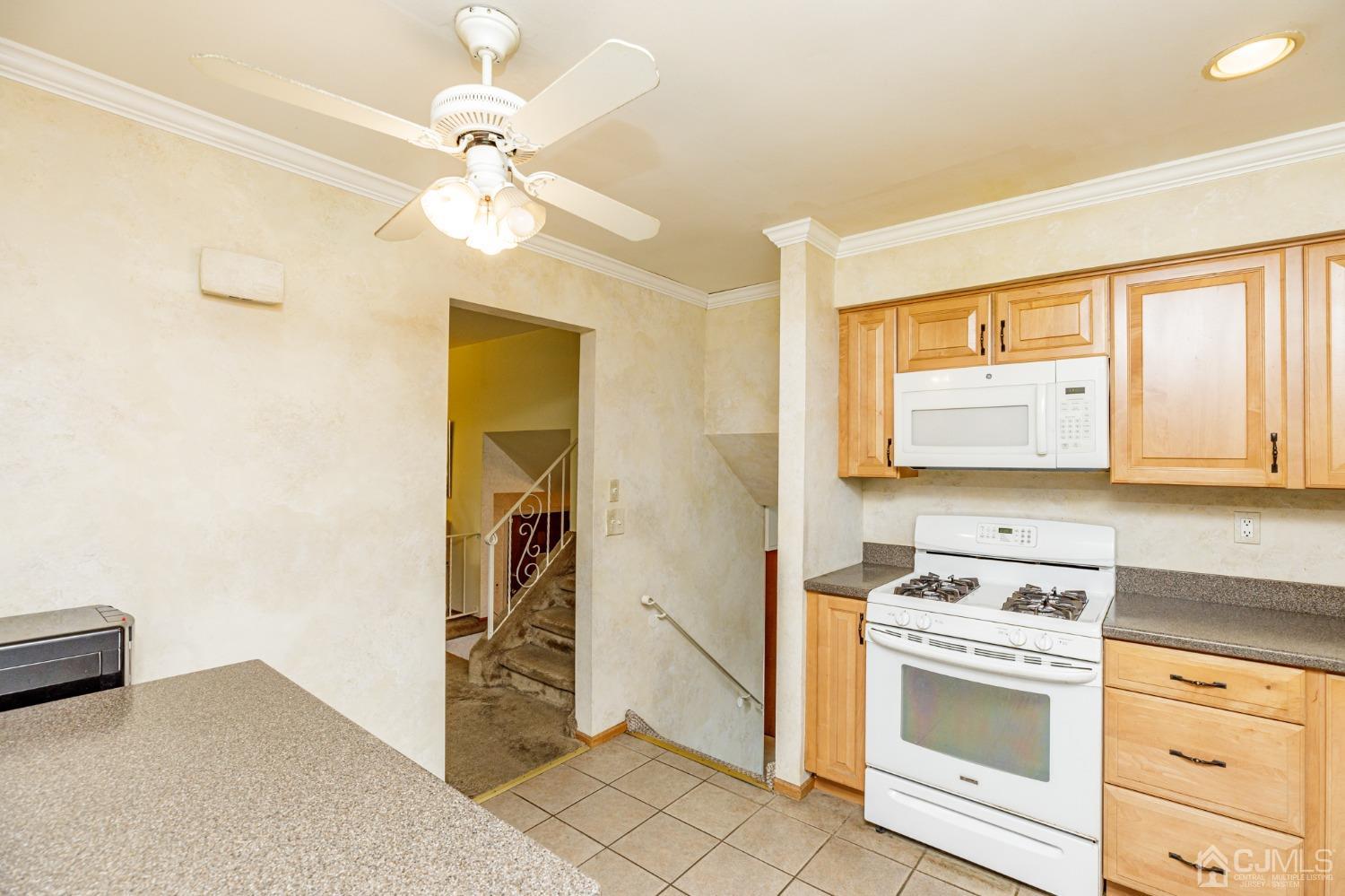 38 Marlin Avenue East Edison, NJ 08820 - Photo 14 of 36 a kitchen with a stove cabinets and a window