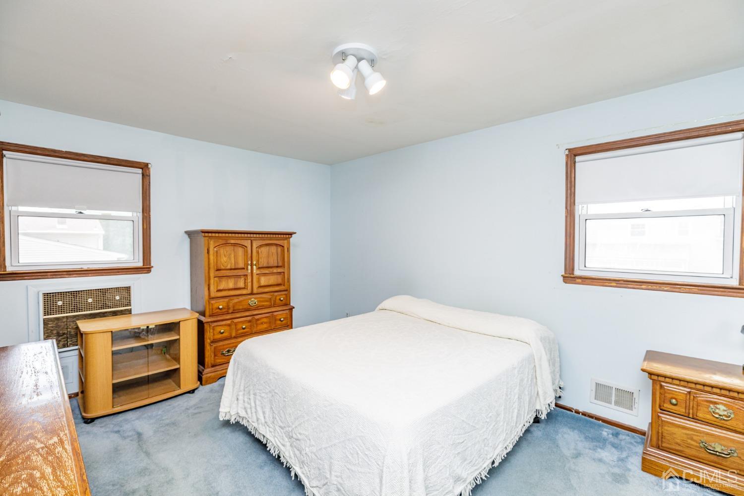 38 Marlin Avenue East Edison, NJ 08820 - Photo 15 of 36 a bedroom with a bed and a window