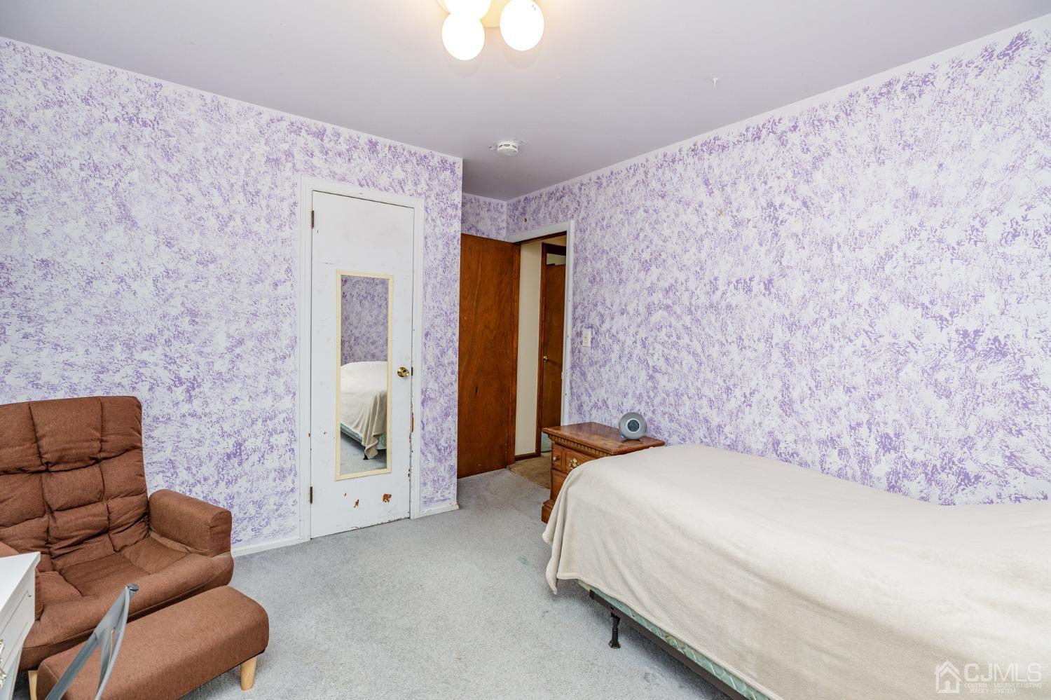 38 Marlin Avenue East Edison, NJ 08820 - Photo 19 of 36 a bedroom with a bed couch and window