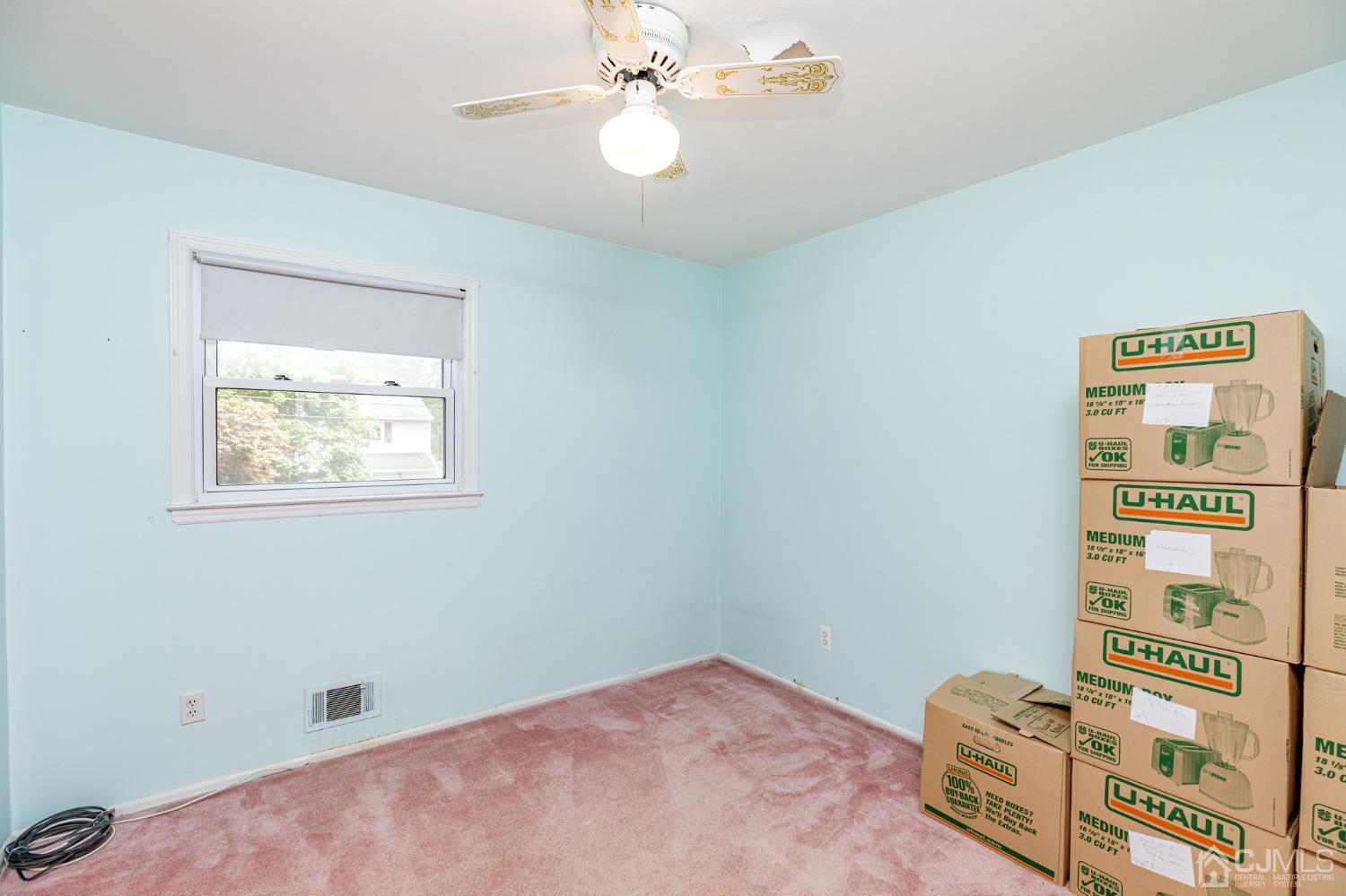 38 Marlin Avenue East Edison, NJ 08820 - Photo 20 of 36 wooden floor in an empty room with a window
