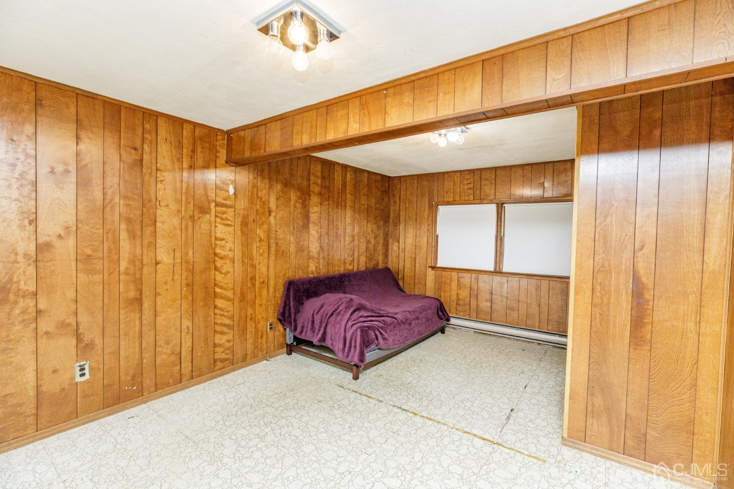 38 Marlin Avenue East Edison, NJ 08820 - Photo 28 of 36 a spacious bedroom with a large window and chandelier