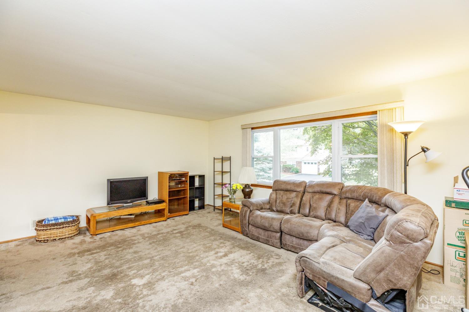 38 Marlin Avenue East Edison, NJ 08820 - Photo 3 of 36 a living room with furniture flat screen tv and a large window