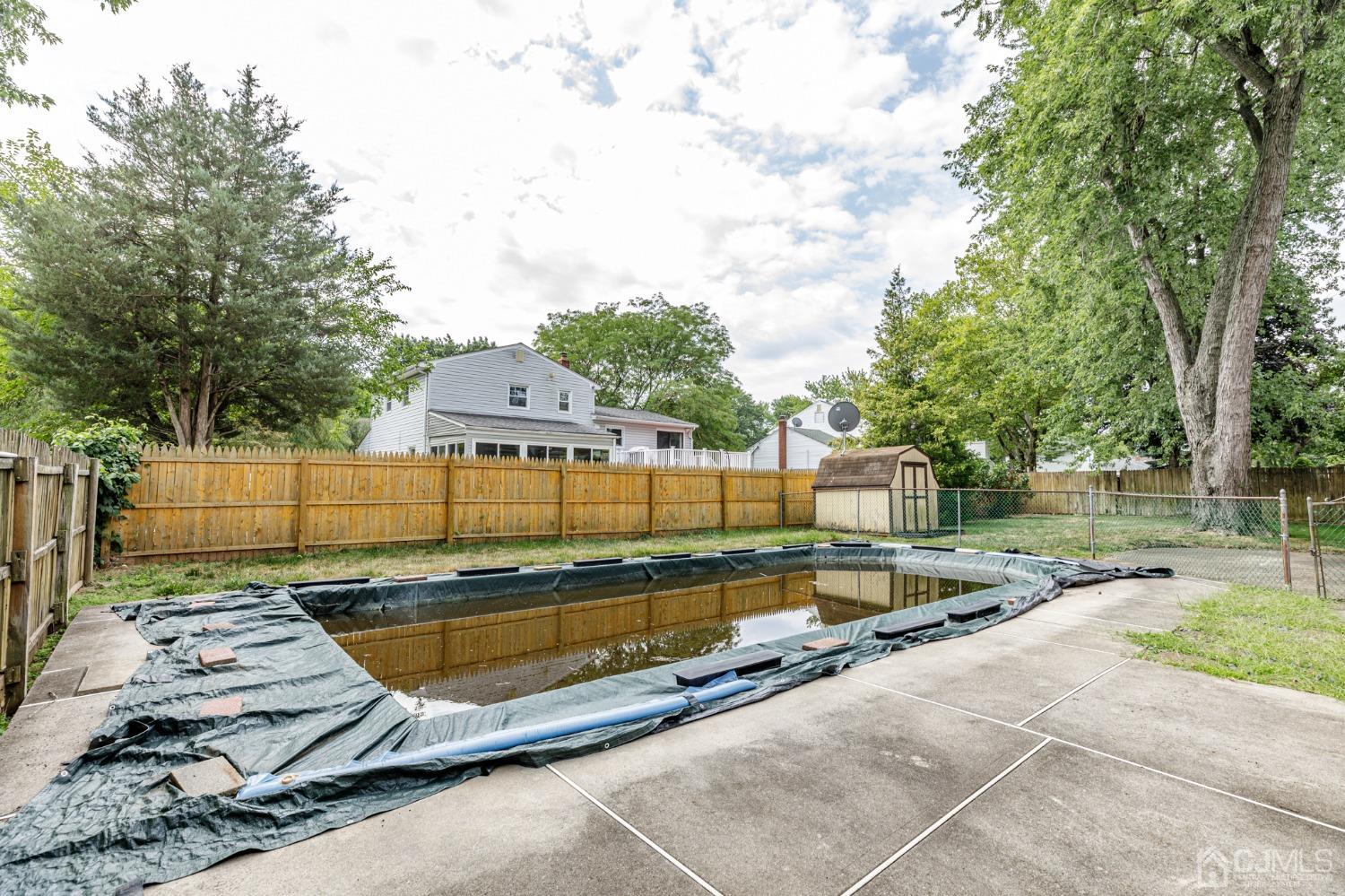 38 Marlin Avenue East Edison, NJ 08820 - Photo 34 of 36 a view of a backyard with a small pool