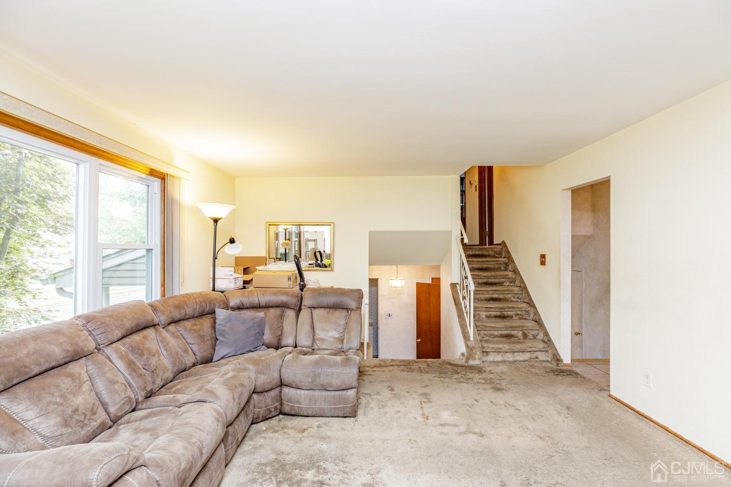 38 Marlin Avenue East Edison, NJ 08820 - Photo 6 of 36 a living room with furniture and a large window