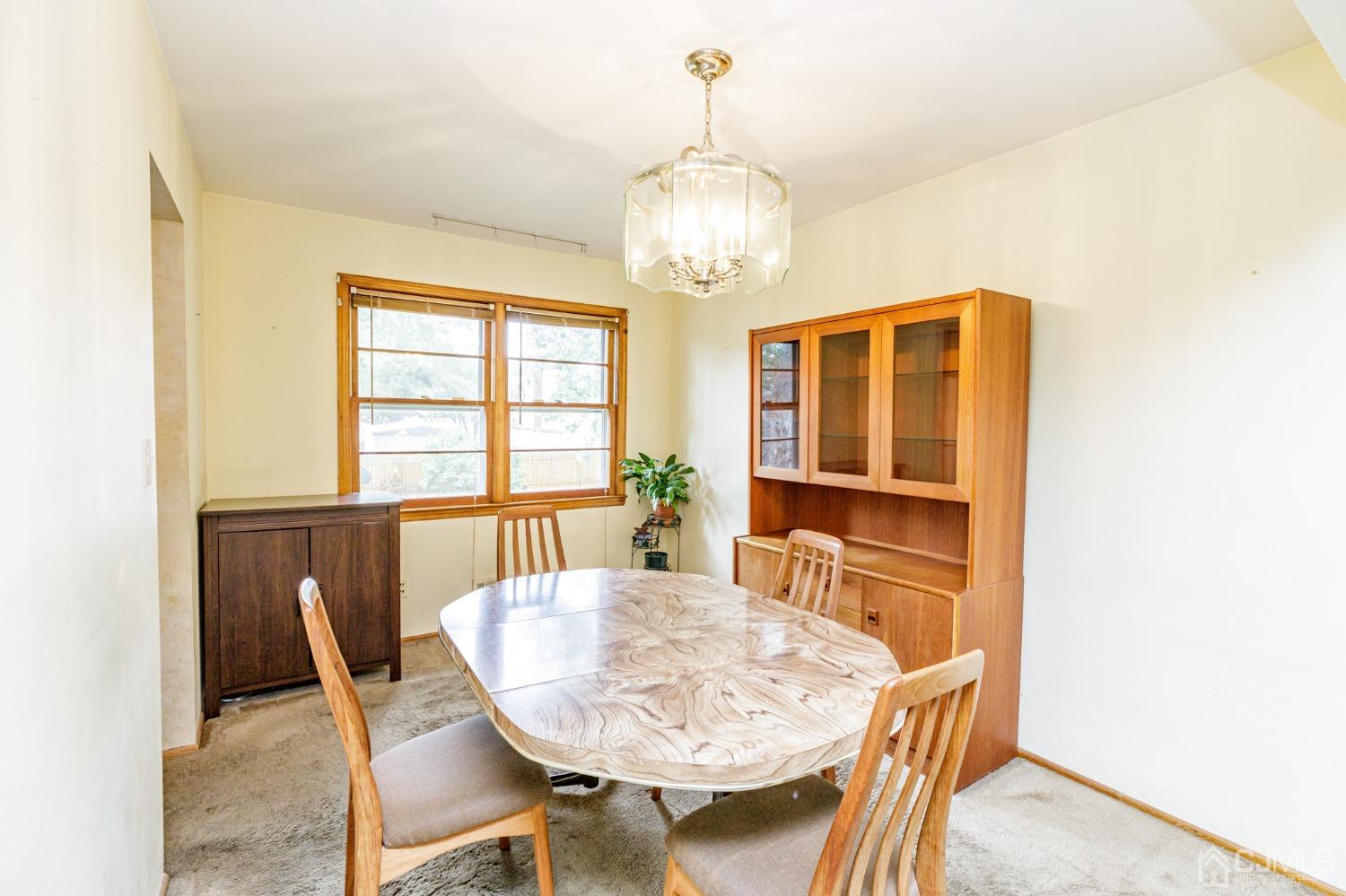 38 Marlin Avenue East Edison, NJ 08820 - Photo 7 of 36 a view of a dining room with furniture and window