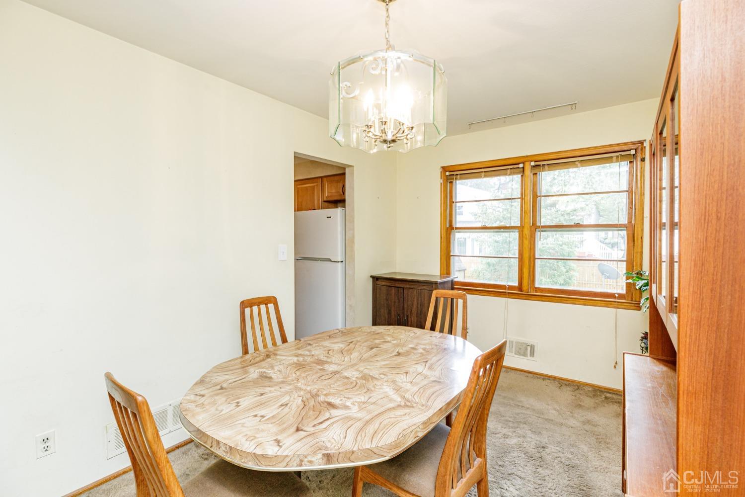38 Marlin Avenue East Edison, NJ 08820 - Photo 8 of 36 a view of a dining room with furniture and window
