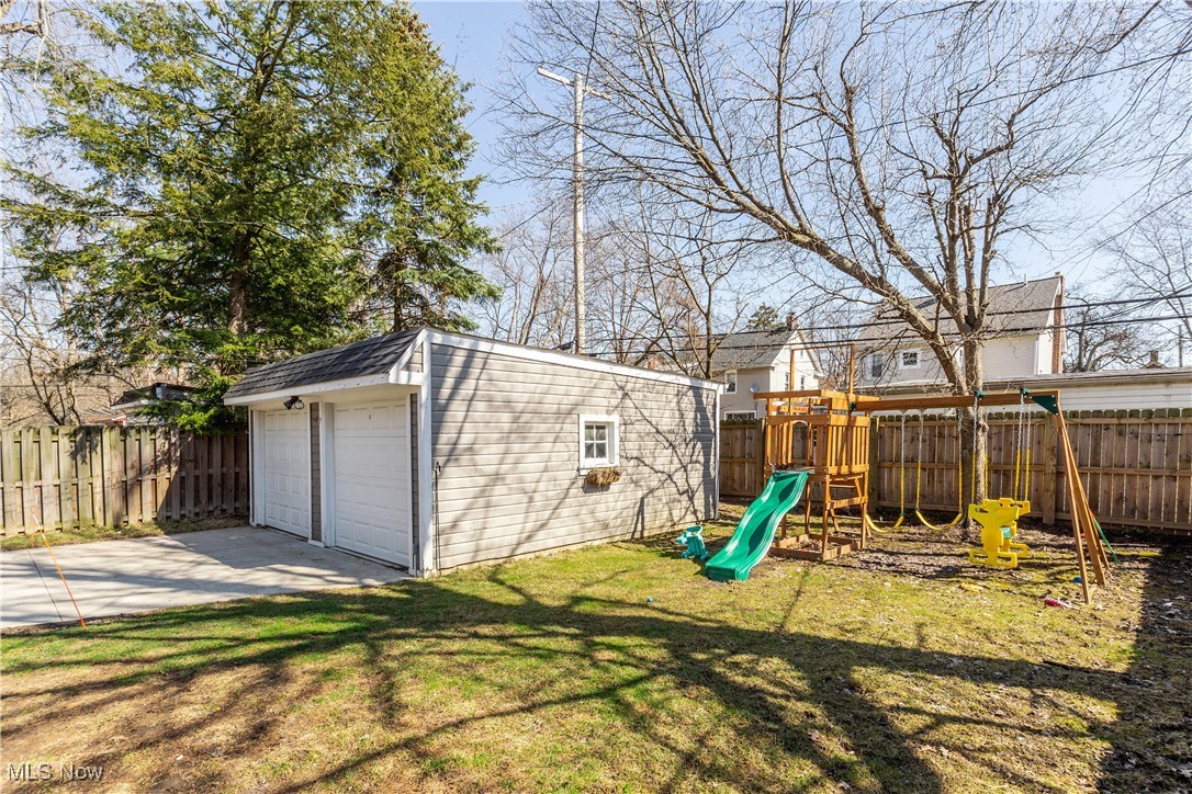2651 Shaker Road Cleveland Heights, OH 44118 - Photo 28 of 28 Fenced backyard featuring a playground, an outdoor structure, and a garage