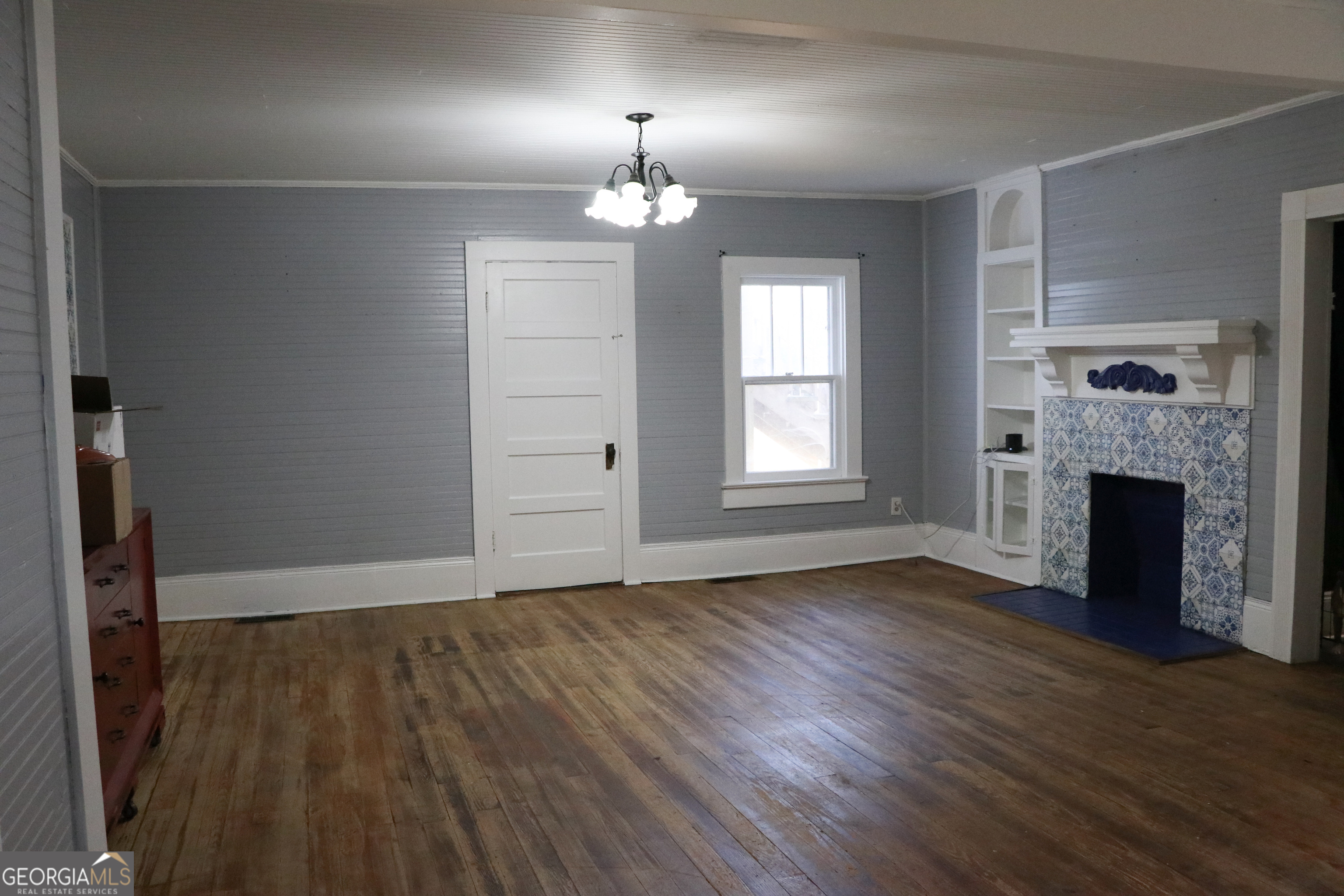 441 Lyerly Dam Road Lyerly, GA 30730 - Photo 25 of 80 an empty room with wooden floor fireplace and window