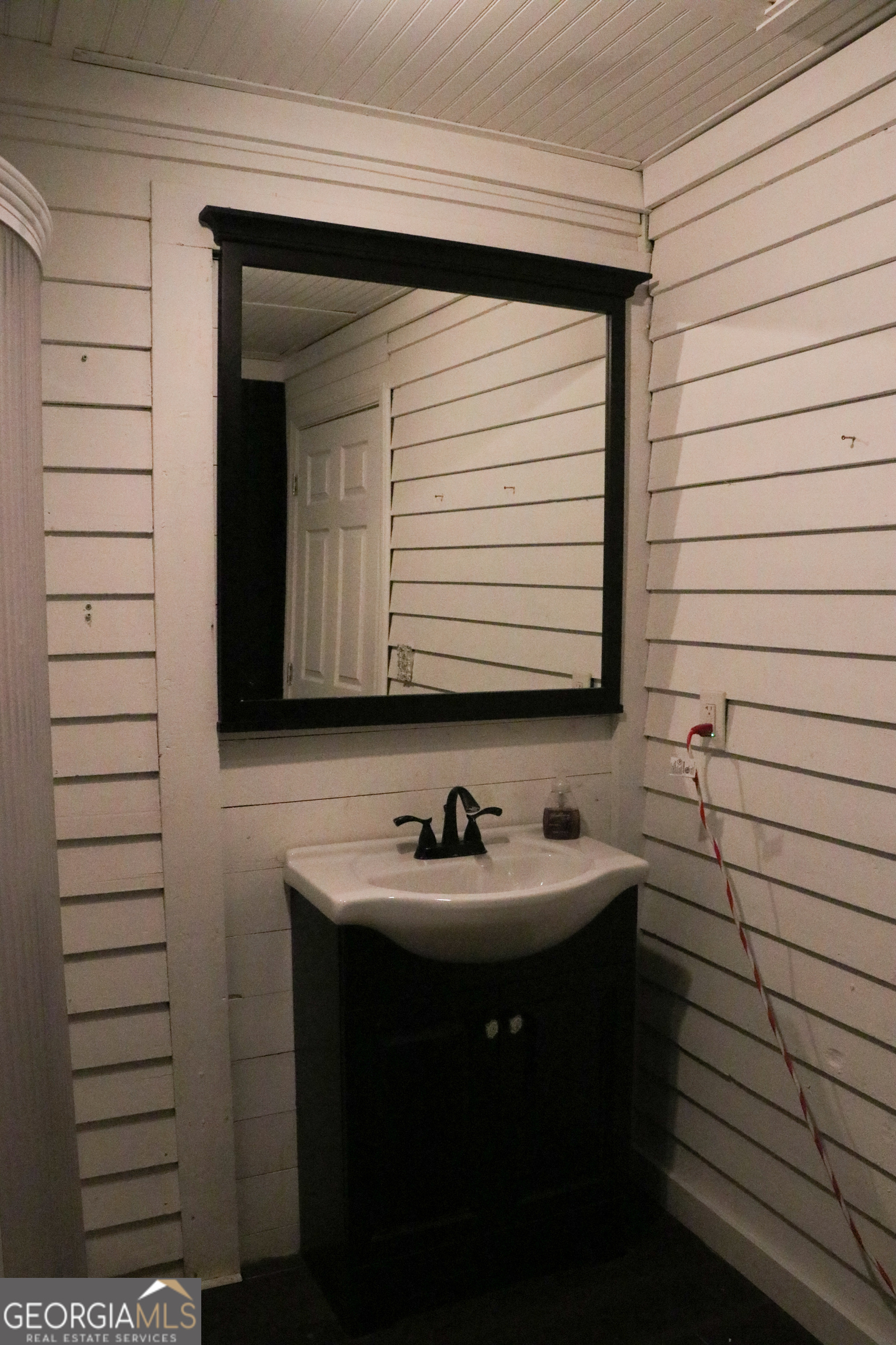 441 Lyerly Dam Road Lyerly, GA 30730 - Photo 40 of 80 a bathroom with a sink and a mirror