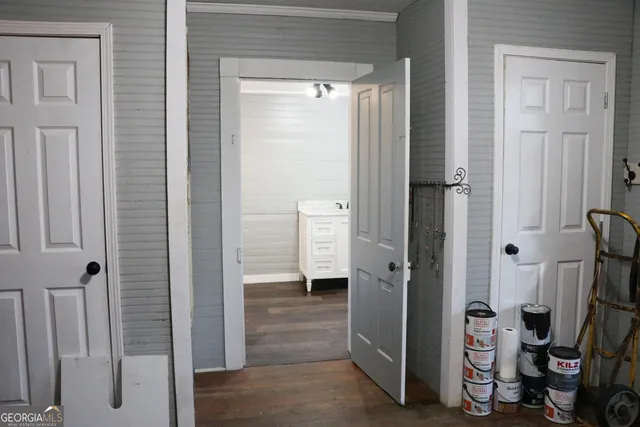 a bedroom with a bed and a mirror