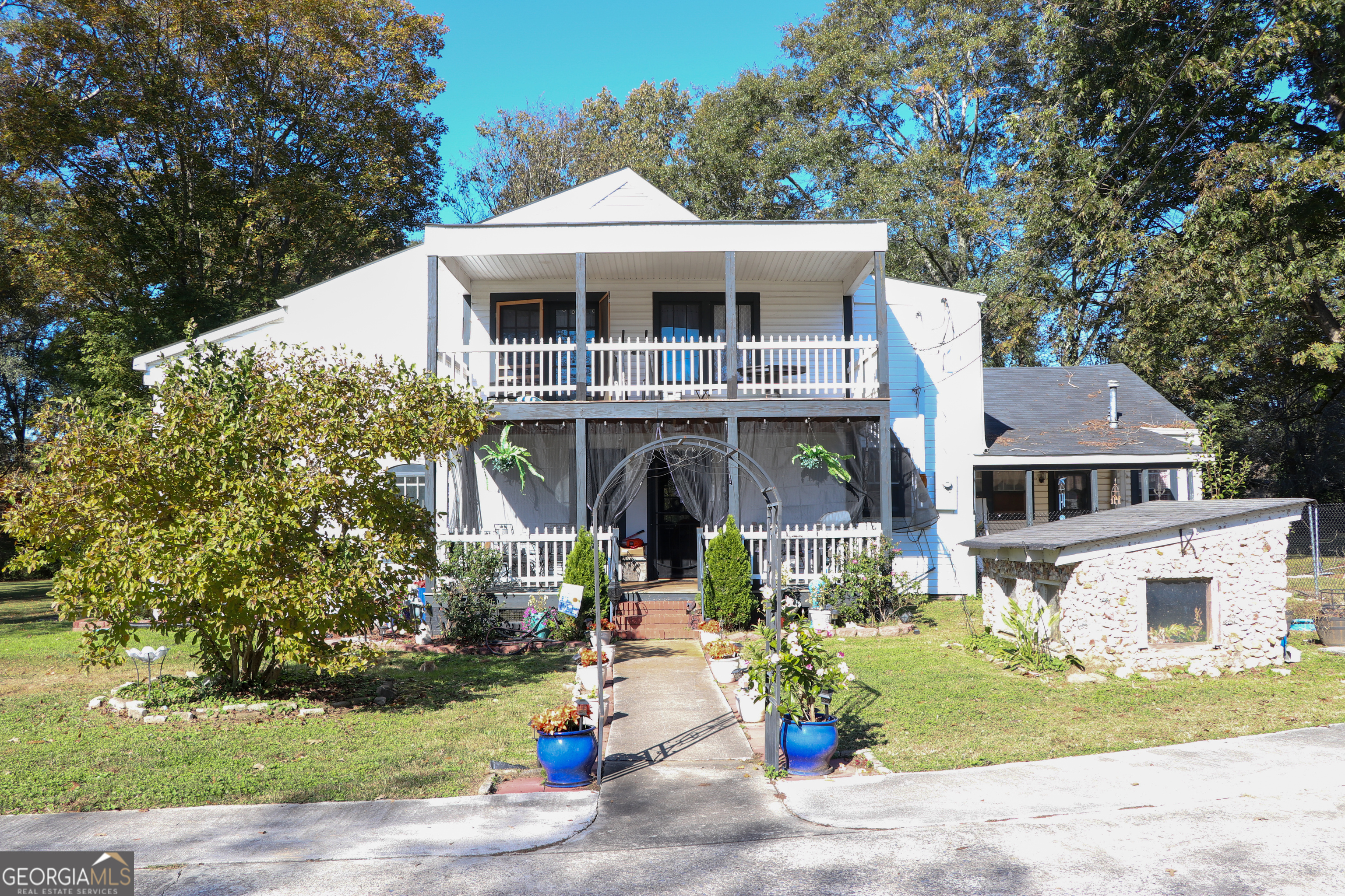 441 Lyerly Dam Road Lyerly, GA 30730 - Photo 5 of 80 a front view of a house with a garden