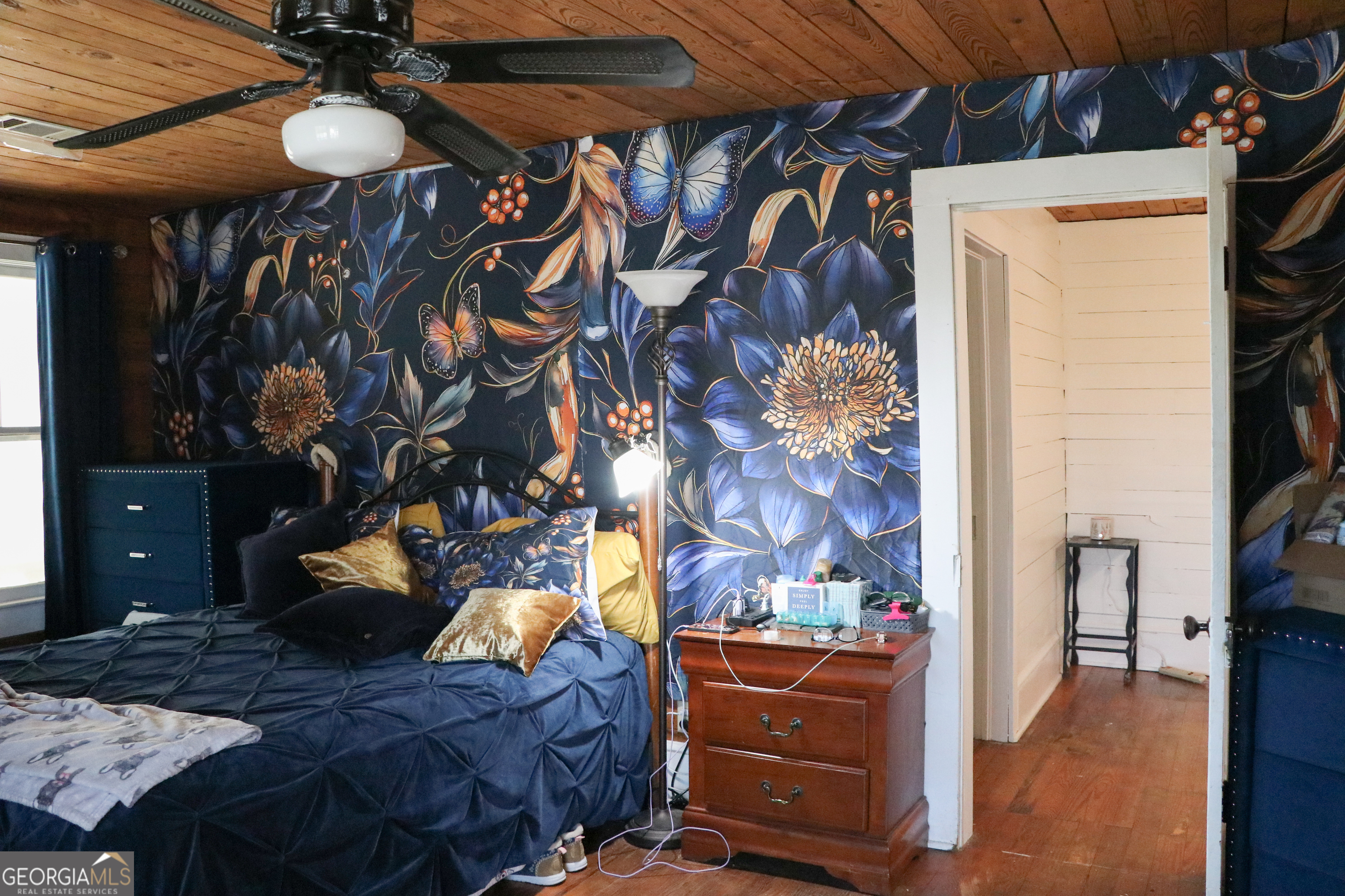 441 Lyerly Dam Road Lyerly, GA 30730 - Photo 61 of 80 a bedroom with a bed and a chandelier