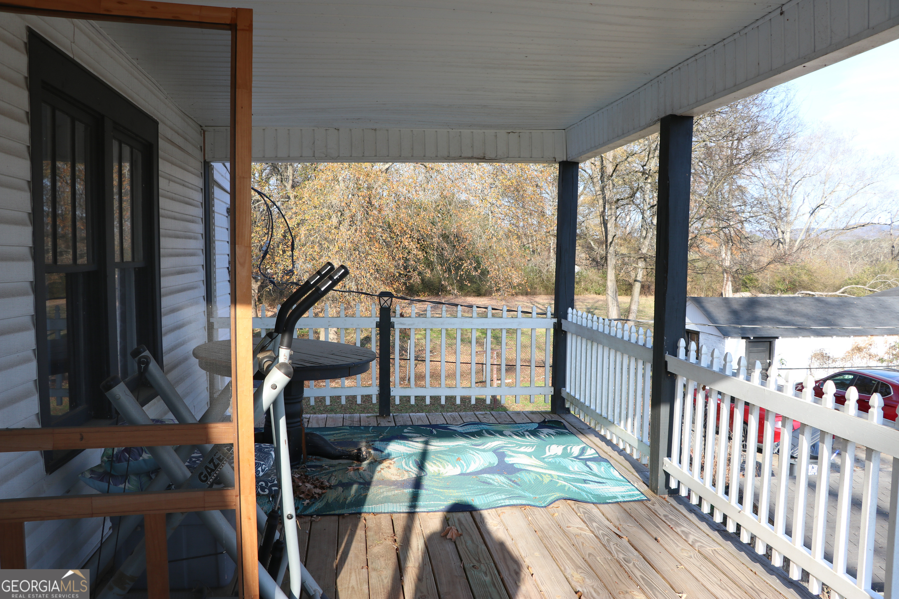 441 Lyerly Dam Road Lyerly, GA 30730 - Photo 65 of 80 a view of a balcony with floor to ceiling window wooden floor