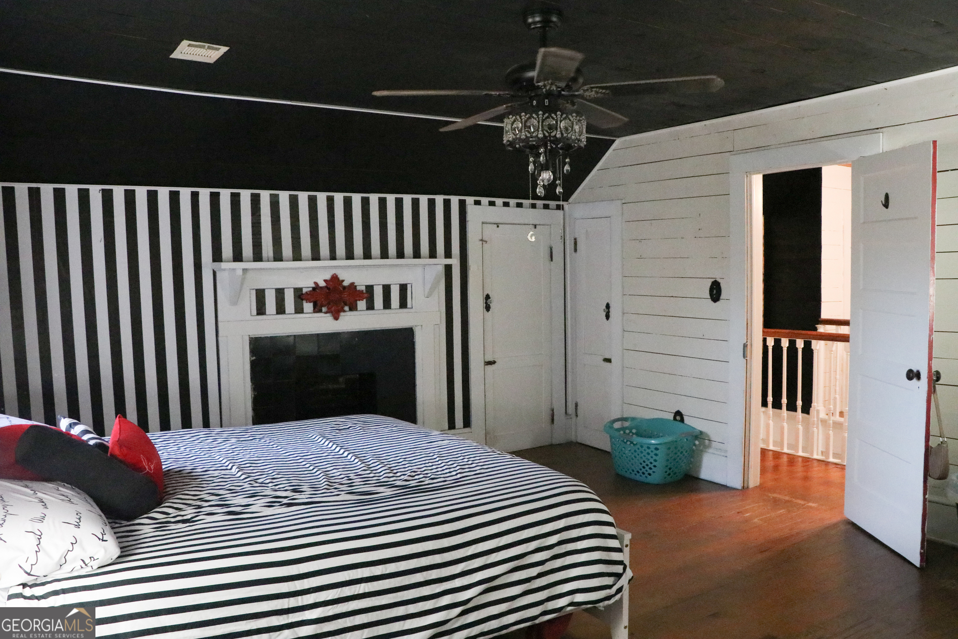 441 Lyerly Dam Road Lyerly, GA 30730 - Photo 74 of 80 a bedroom with bed and a chandelier