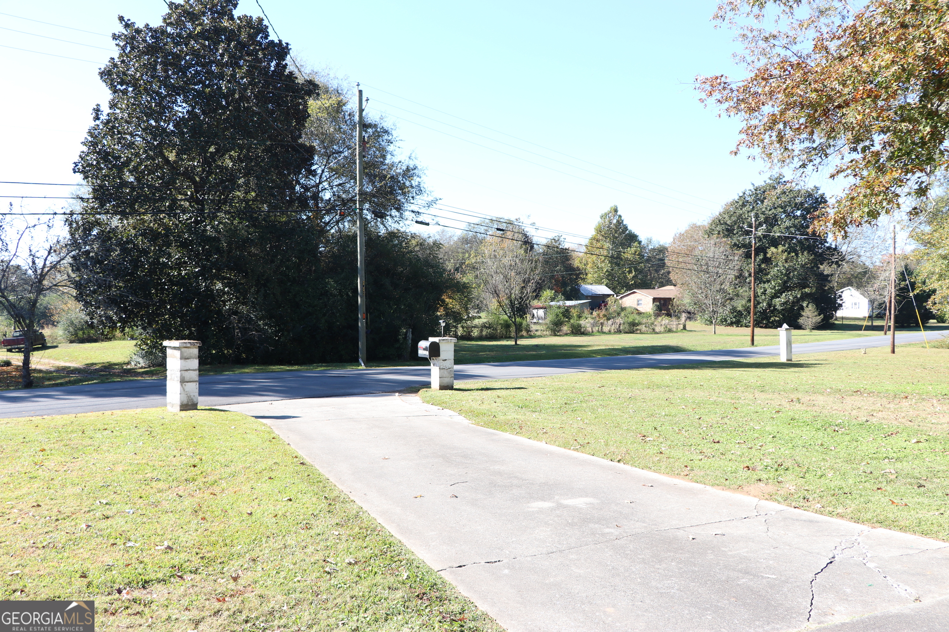 441 Lyerly Dam Road Lyerly, GA 30730 - Photo 10 of 80 a view of a swimming pool with a bench and trees around